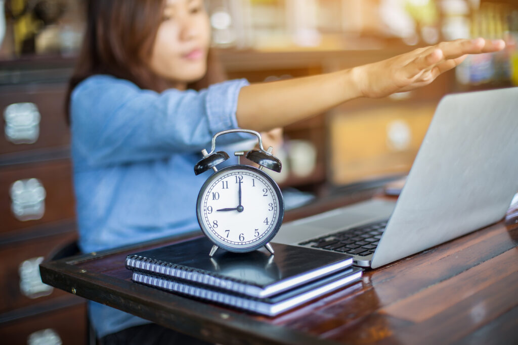 midsection woman using mobile phone table