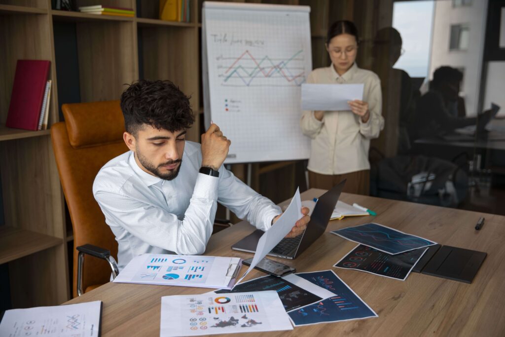 office workers using finance graphs 1 1