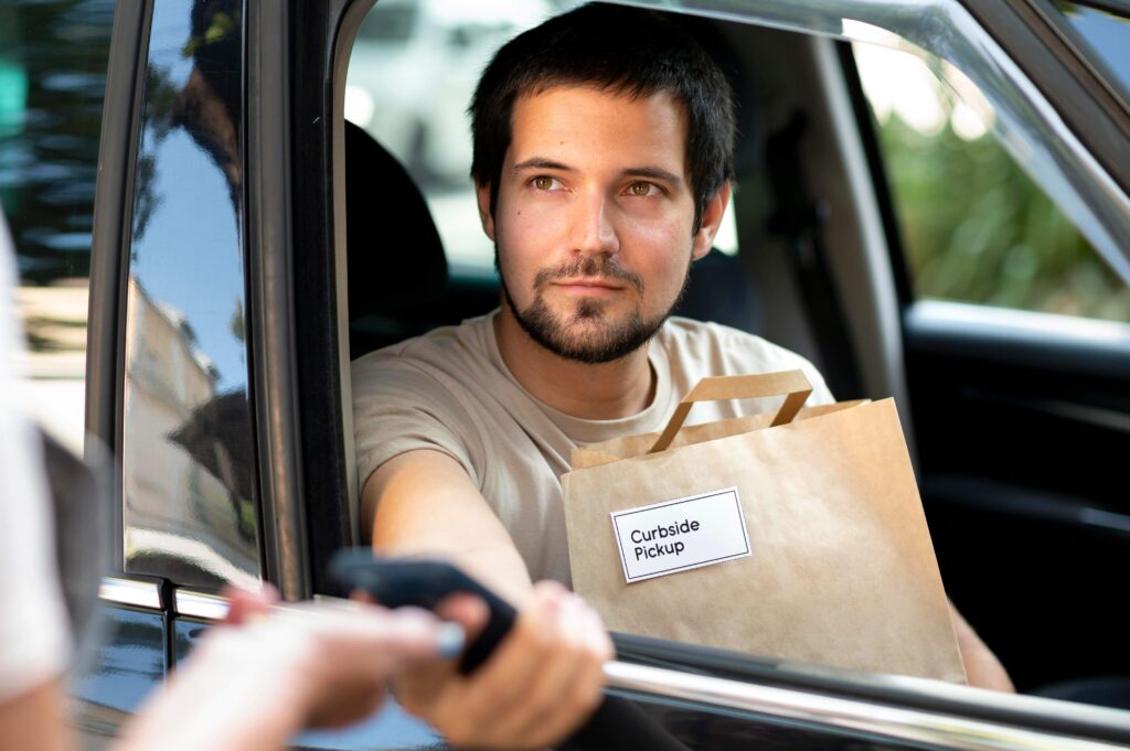 person giving order customer curbside pickup 2